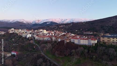 Aerial images of Bejar in the province of Salamanca with the Sierra Nevada mountains in the background during sunset, 4k 30fps 1 inch sensor DJI, drone image