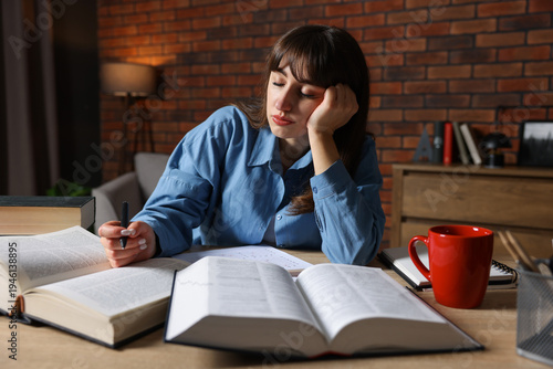 Принти на полотні Woman feeling fatigue at wooden desk indoors
