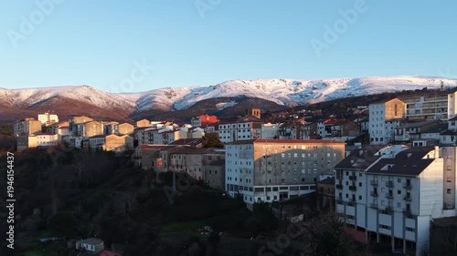 Aerial images of Bejar in the province of Salamanca with the Sierra Nevada mountains in the background during sunset, 4k 30fps 1 inch sensor DJI, drone image