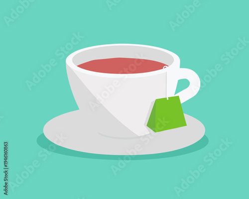 A white cup of hot tea with a green tea bag on a saucer