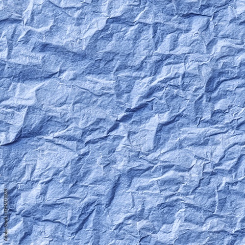 Seamless pattern of handmade style blue wrinkled paper with organic creases and textured surface for craft inspired layouts