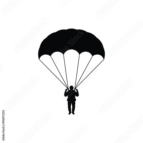 Silhouette of a parachutist descending with a fully deployed canopy