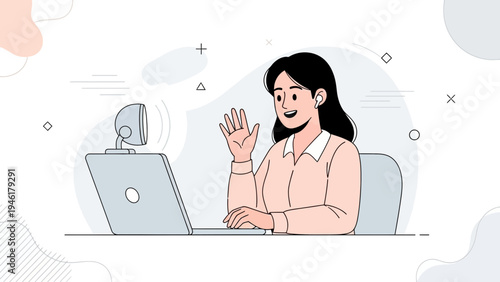 Young woman waving hello during a video call on her laptop