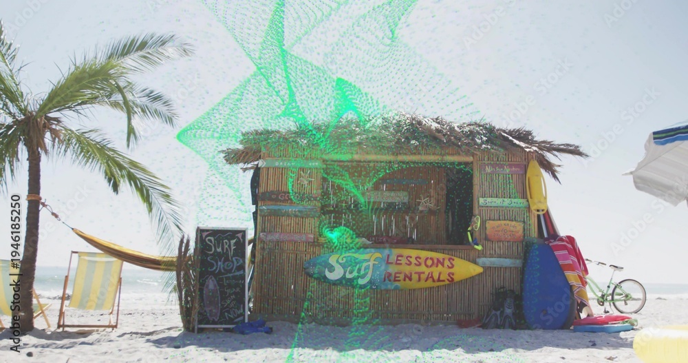 Fototapeta premium Displaying bamboo tiki surf rental hut on sandy beach, showing LESSONS RENTALS sign, surfboards