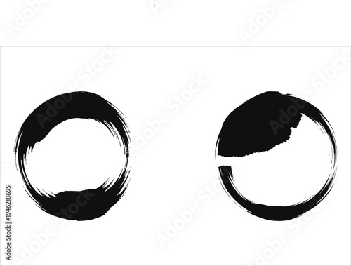 Two black brush stroke circles on white background
