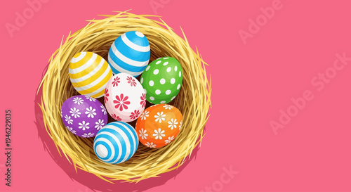  Colorful Easter eggs rest in straw nest on pink background, cheerful spring still life, top view with copy space for design