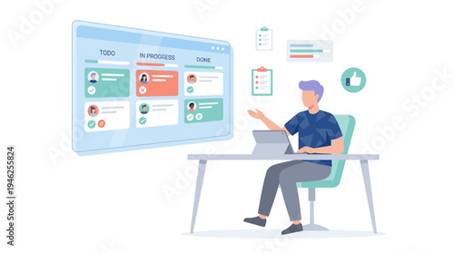 A man interacts with a large computer monitor while sitting at a desk with a laptop.