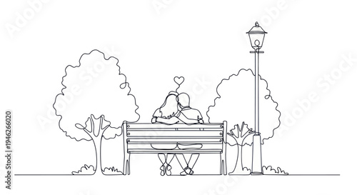 Romantic couple sitting on a park bench under a street lamp.