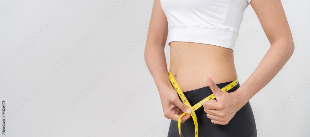 © Shisu_ka - women happy results of diet. Beautiful shape. female have a reduced waist size after under going a weight loss corse. can not wear jean due to weight loss. balance, control, routines, exercise.