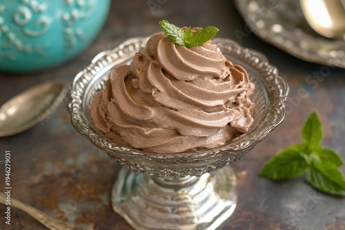 Rich chocolate mousse swirled in a decorative glass dish