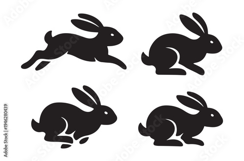 Four black silhouettes of rabbits in various hopping poses
