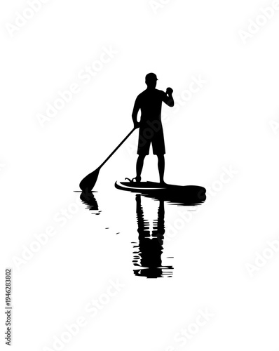 Silhouette of a man paddleboarding on calm water