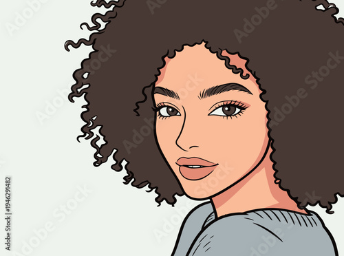 A woman with curly hair is smiling while wearing a casual sweater. She is indoors and seems relaxed and happy.