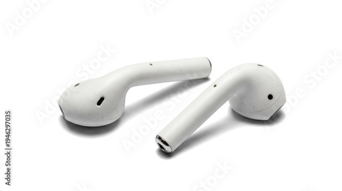 Photos realistic photograph of two white wireless earbuds, close-up studio shot against a transparent background, highlighting their modern design and portability for personal audio