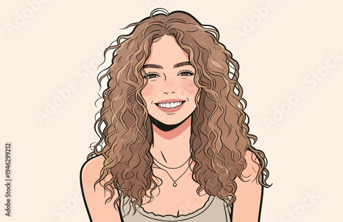 A woman with curly hair smiles while sitting in a bright room with a simple background. She appears happy and relaxed.