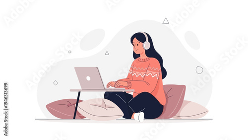Young Woman Working on Laptop with Headphones on Cushions