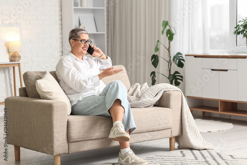 Happy mature blonde woman w...