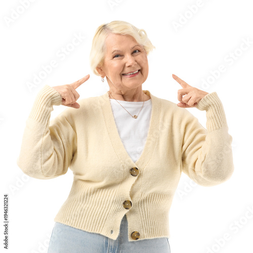 Senior woman pointing at he...