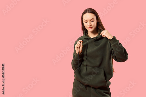 Young woman in sports suit ...