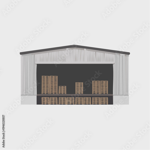 Gray warehouse building with haystacks inside storage facility