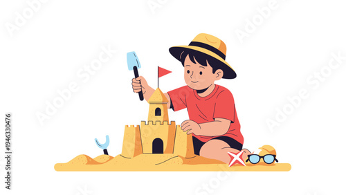 Young boy in a sun hat and red shirt building a large sandcastle with a red flag on a sandy beach.