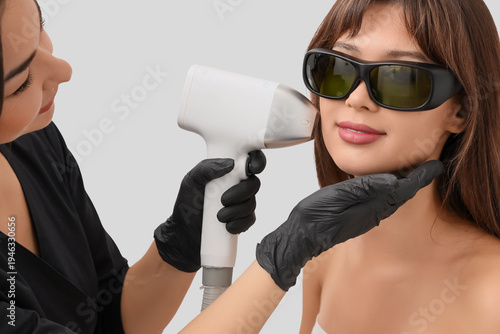 Female cosmetologist perfor...