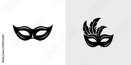 Two black Venetian masks with feathers and smooth designs on white background for carnival