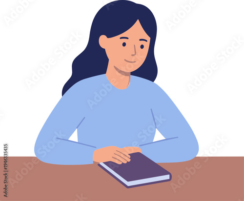 Woman sitting at a table reading a book with a slight smile on her face indoors