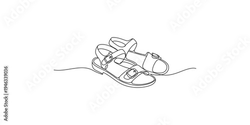 Continuous line drawing of a pair of sandals on a white background