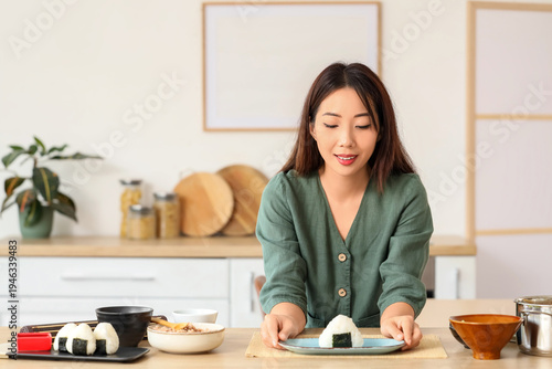 Young Asian woman with trad...