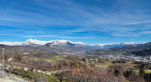 Bild auf Leinwand View over the snow capped French Alps mountains in distance from Domaine de Charance, France