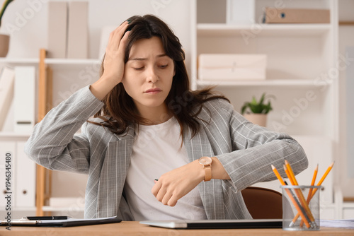 Stressed young businesswoma...
