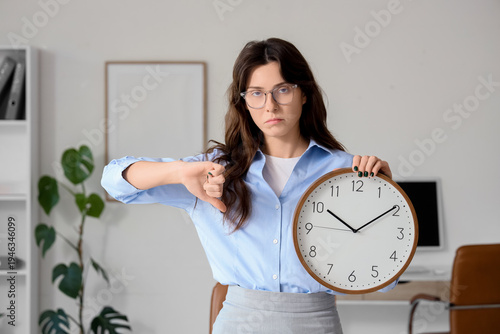 Tired young businesswoman w...