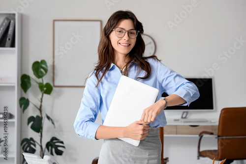 Smiling young businesswoman...
