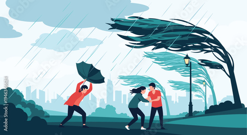 People are struggling against heavy rain and strong wind during a storm in a city park with bending trees.