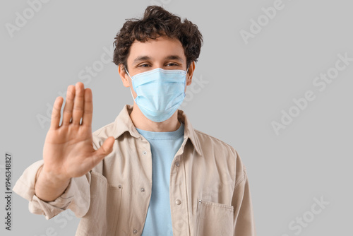 Young man in medical mask s...