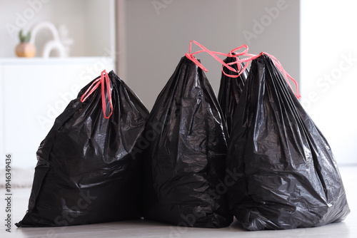Full black garbage bags on ...