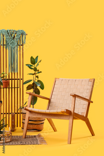 Armchair with plant and fol...