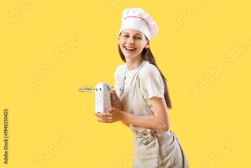 Female chef with mixer on y...