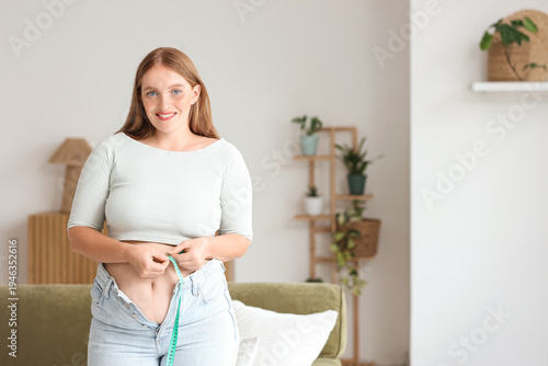 Young happy overweight woma...