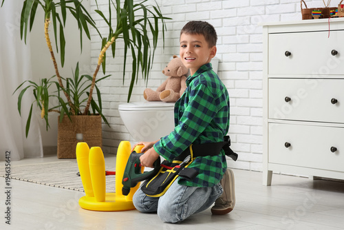 Cute little happy handyman ...