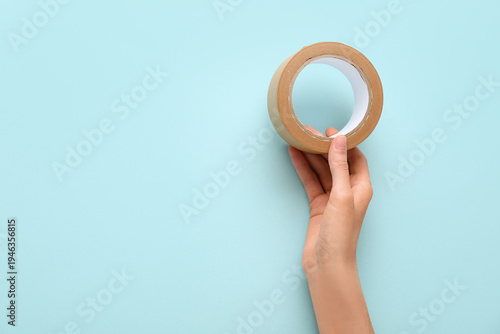Female hand with roll of br...
