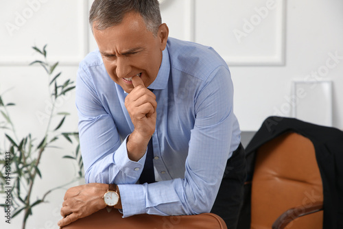 Worried mature businessman ...