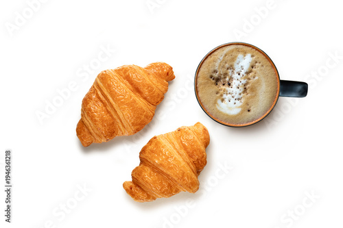 Cup of hot latte art coffee with coffee beans and two golden crispy croissants. Isolated on white background.