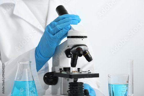 Female scientist with flask...