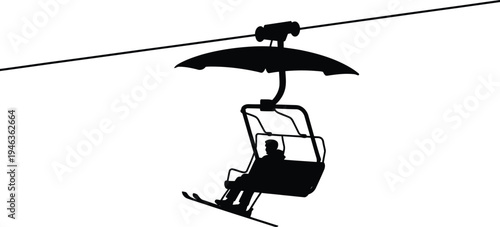 Person riding a ski lift up a mountain, enjoying winter sport and scenic views