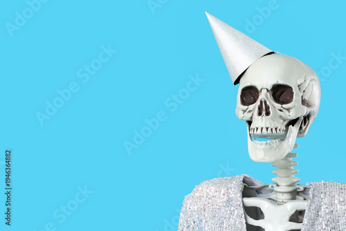 Human skeleton in party hat...