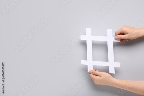 Female hands holding hashta...