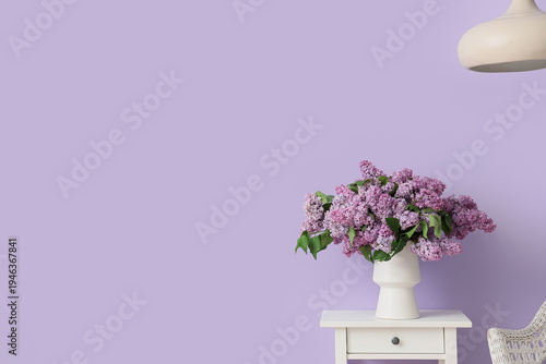 Vase with lilac flowers on ...