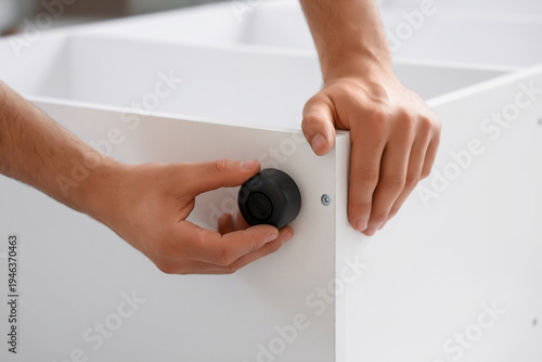 Male hands with caster asse...
